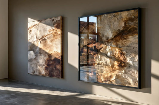 Stretched canvas and framed print wall art displayed side by side on a gallery wall, showing the textured canvas weave versus the glass-framed finish