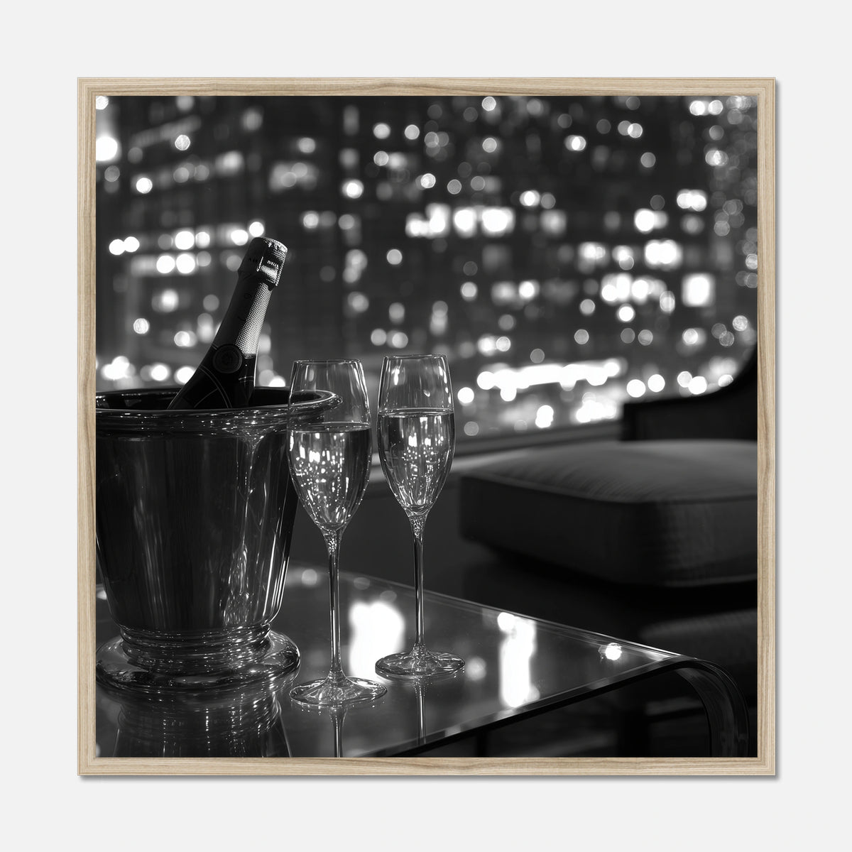 Natural oak framed wall art of two champagne glasses and a bottle in an ice bucket on a table with a cityscape in the background.