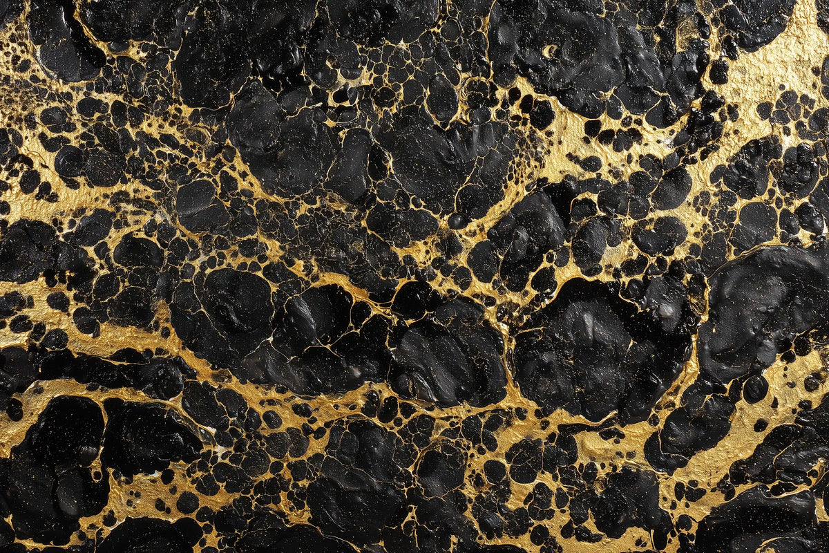 Black and gold marbled pattern with organic black veining over a metallic gold background.