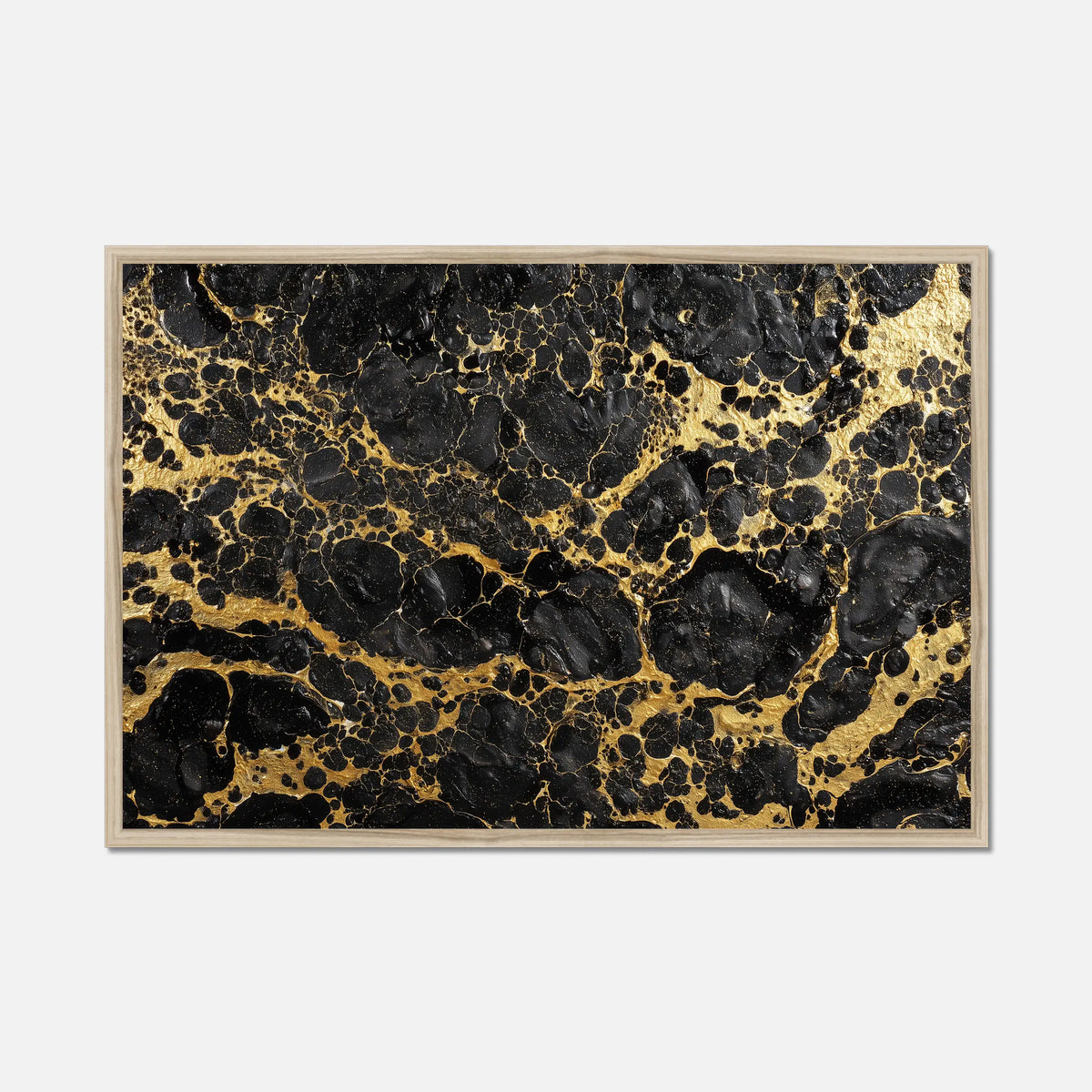 Framed artwork with black and gold abstract pattern on a white background