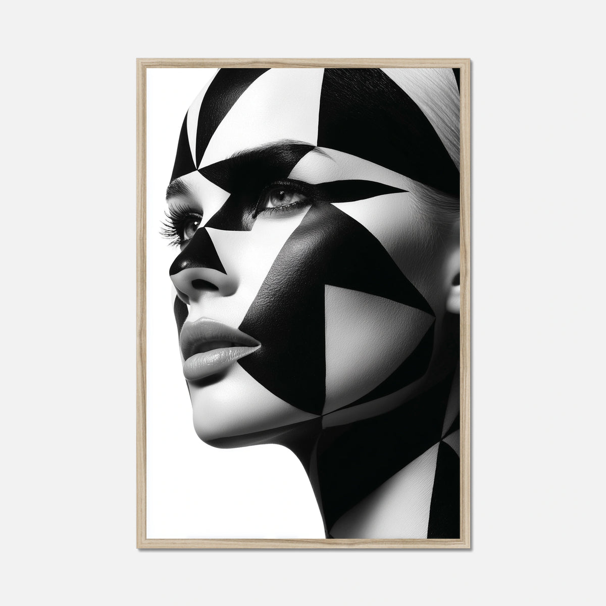Natural oak framed close-up portrait of a woman's face with dramatic black and white geometric face paint and makeup, shown against a plain white background.