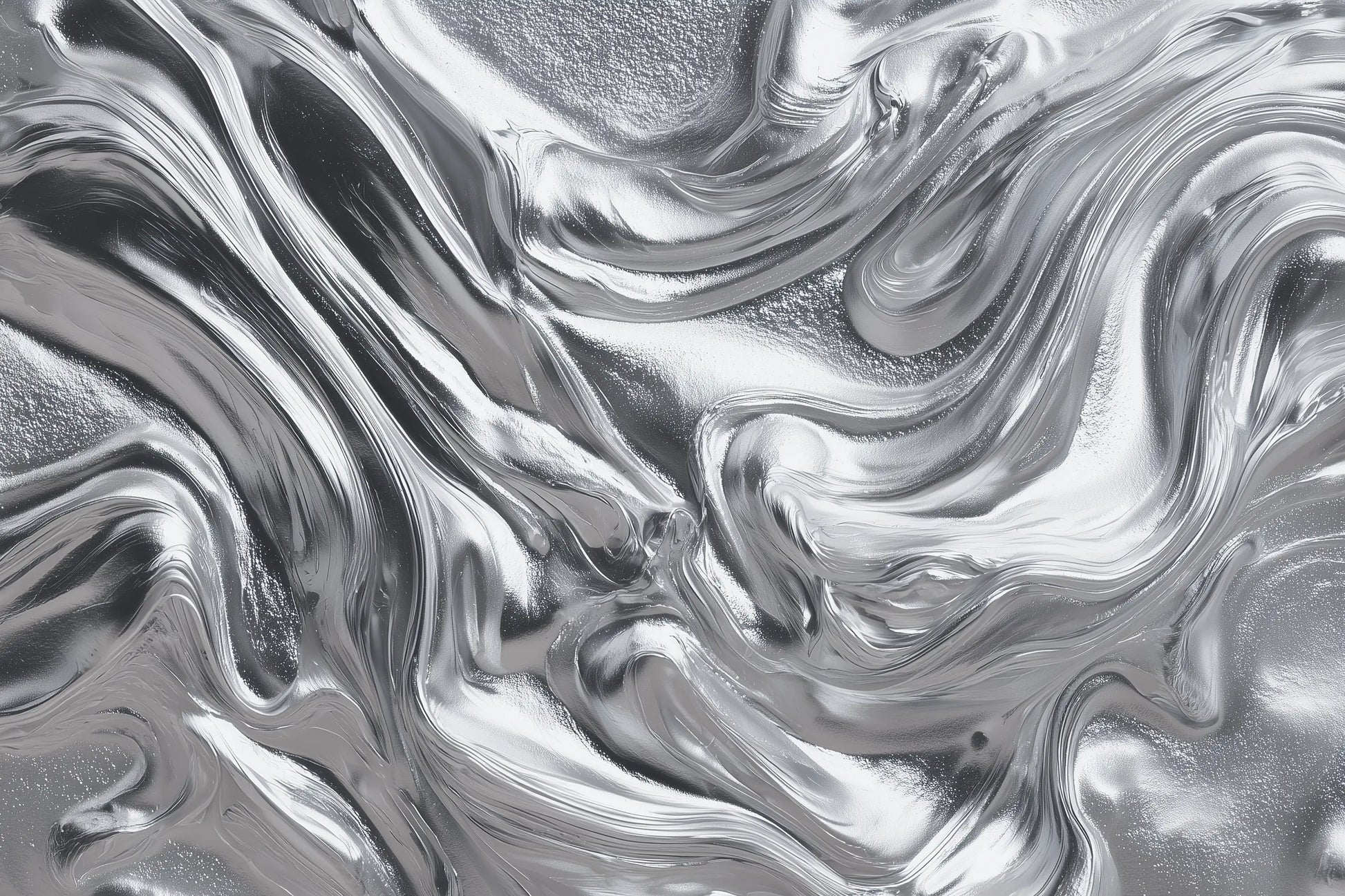 A close-up of a metallic silver surface with a fluid, marbled texture and reflective highlights.