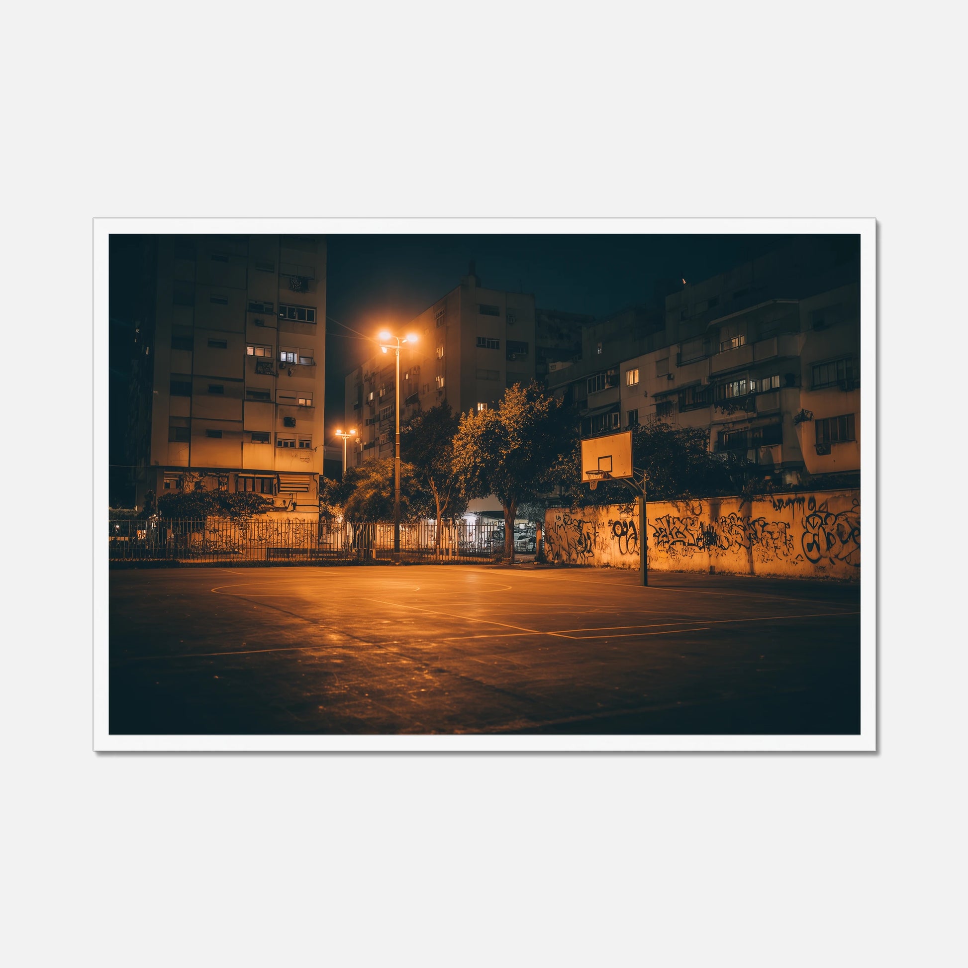 Street basketball court at night with buildings in the background