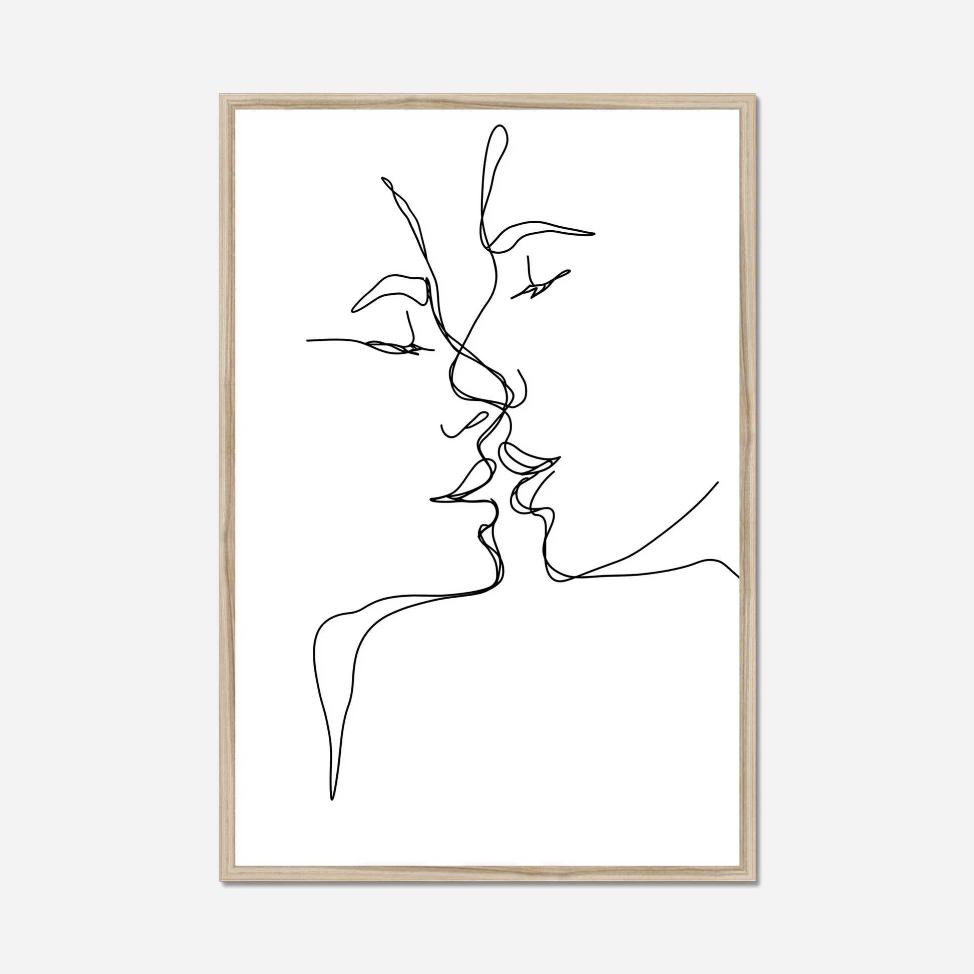 Black thin line art of two faces kissing in a natural oak frame