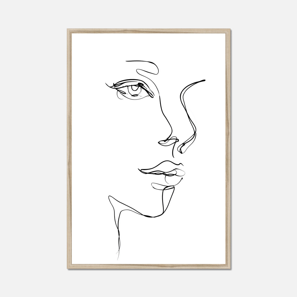 A minimalist black and white line art print of a woman's face in profile, presented in a thin natural oak frame against a light gray background.