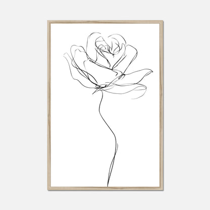 A minimalist black line art print of a rose on a white background, framed in a light natural wood frame, shown against a light gray wall.
