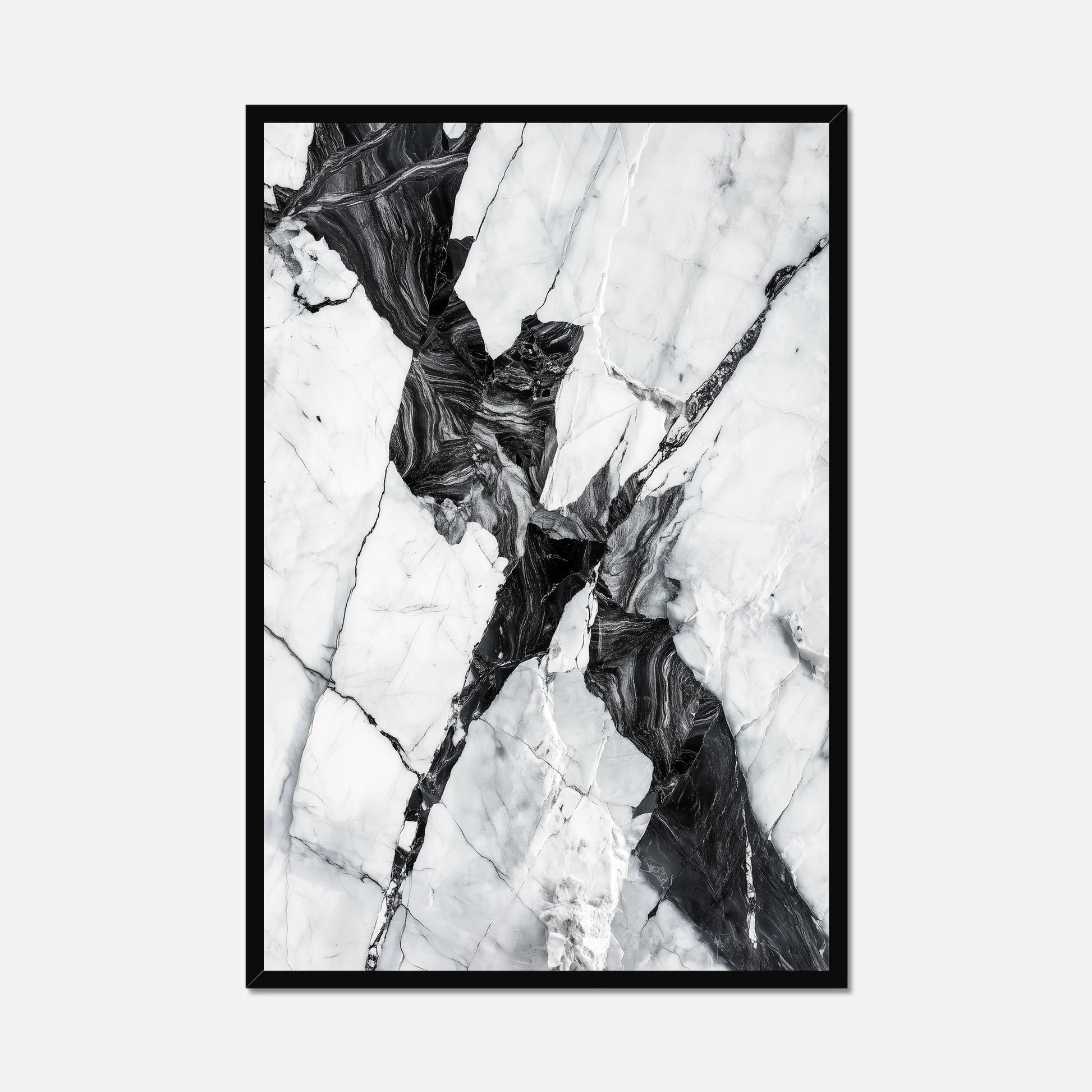Black framed black and white marble wall art on a white background