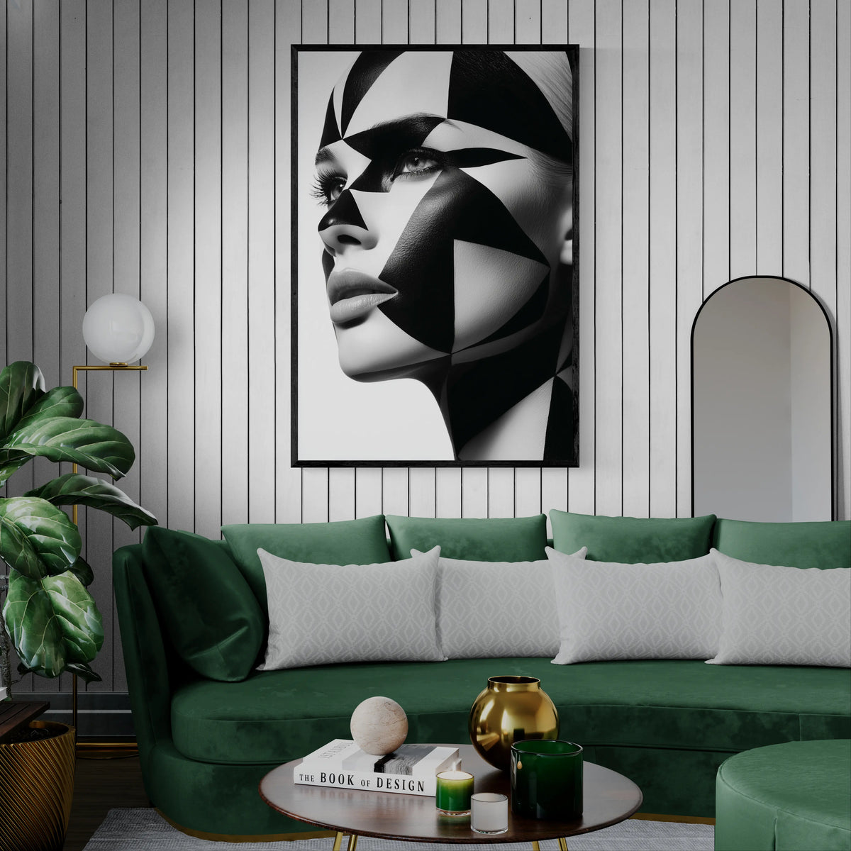 Modern living room with green sofa and white pin stripe wall. Black framed close-up portrait of a woman's face with dramatic black and white geometric face paint and makeup, shown against a plain white background.