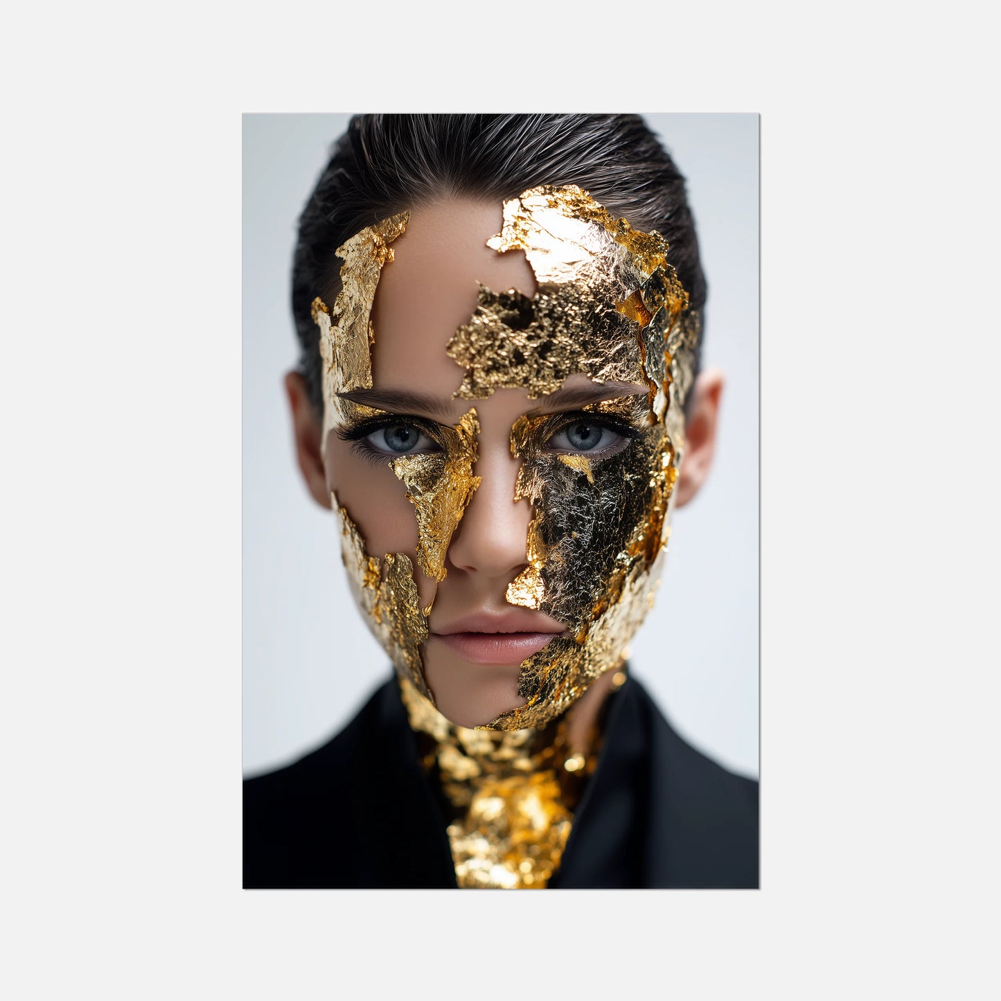 Person with gold leaf on face against a light gray background