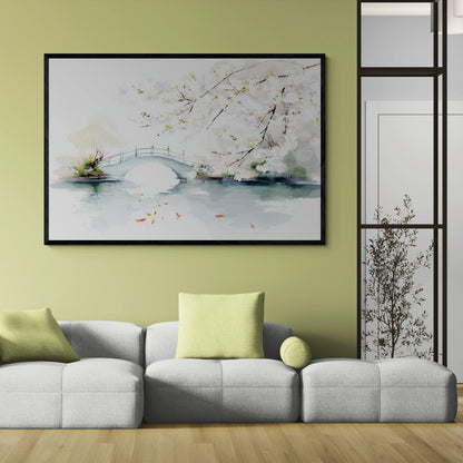 Living room with a gray sofa, green pillows, and a black framed artwork of a bridge and cherry blossoms over water on a white background