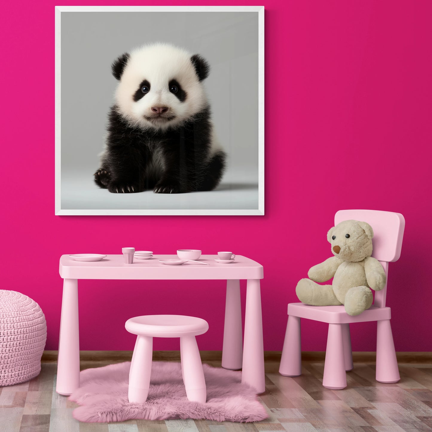 Children's playroom with pink furniture, teddy bear, and panda framed print on a pink wall.