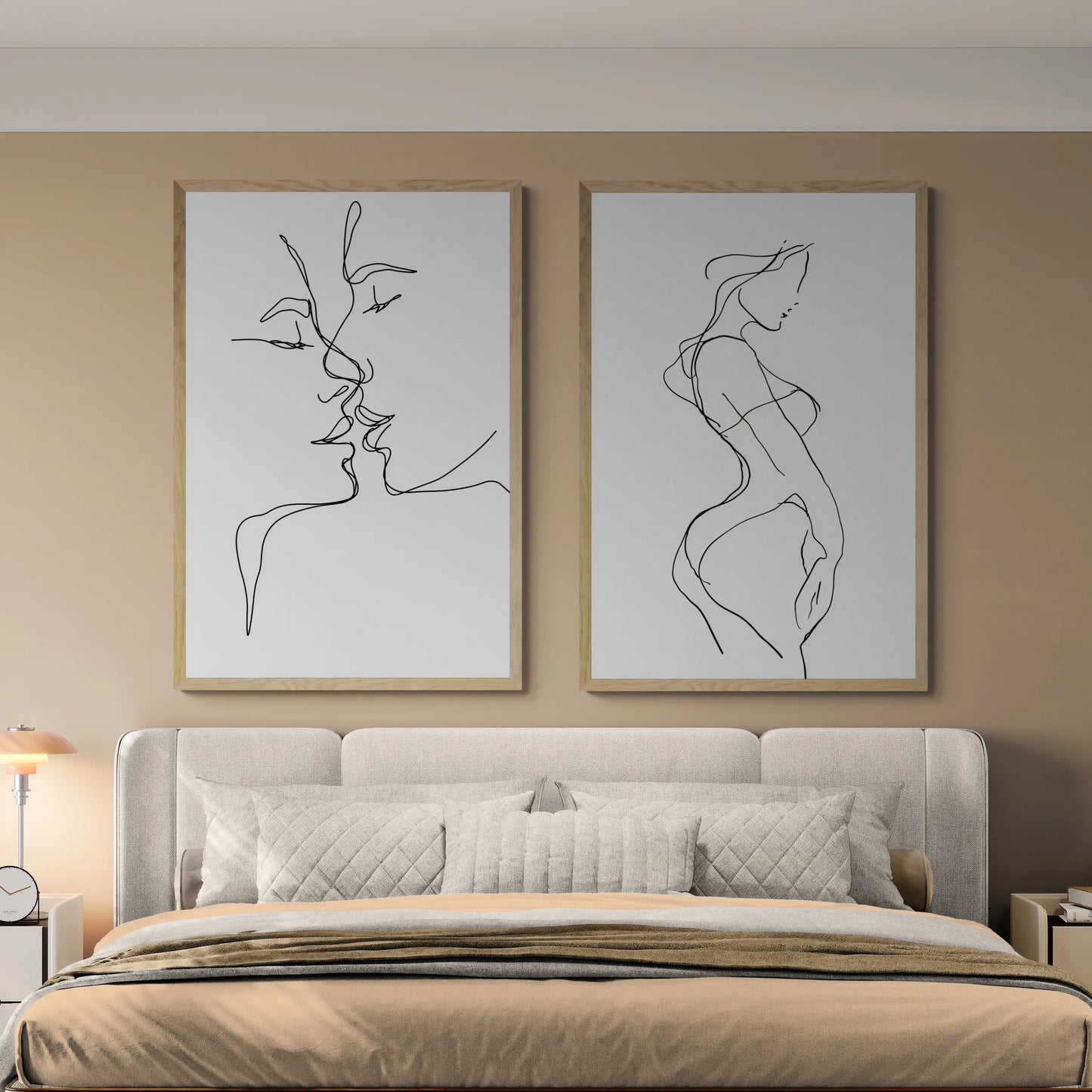 The best bedroom with two thin line wall art pieces above a grey bed and beige blankets