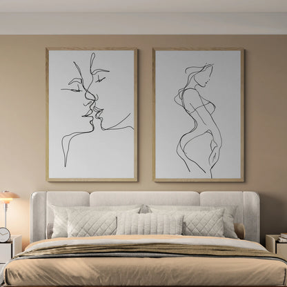 The best bedroom with two thin line wall art pieces above a grey bed and beige blankets