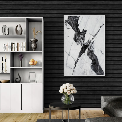 Modern interior with a white bookshelf, abstract art, and a vase with flowers on a table.