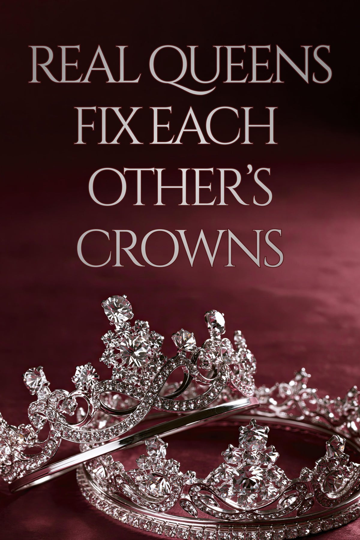 Two ornate silver tiaras with sparkling clear stones on a dark burgundy background, with the text 'REAL QUEENS FIX EACH OTHER'S CROWNS' in large silver lettering at the top.
